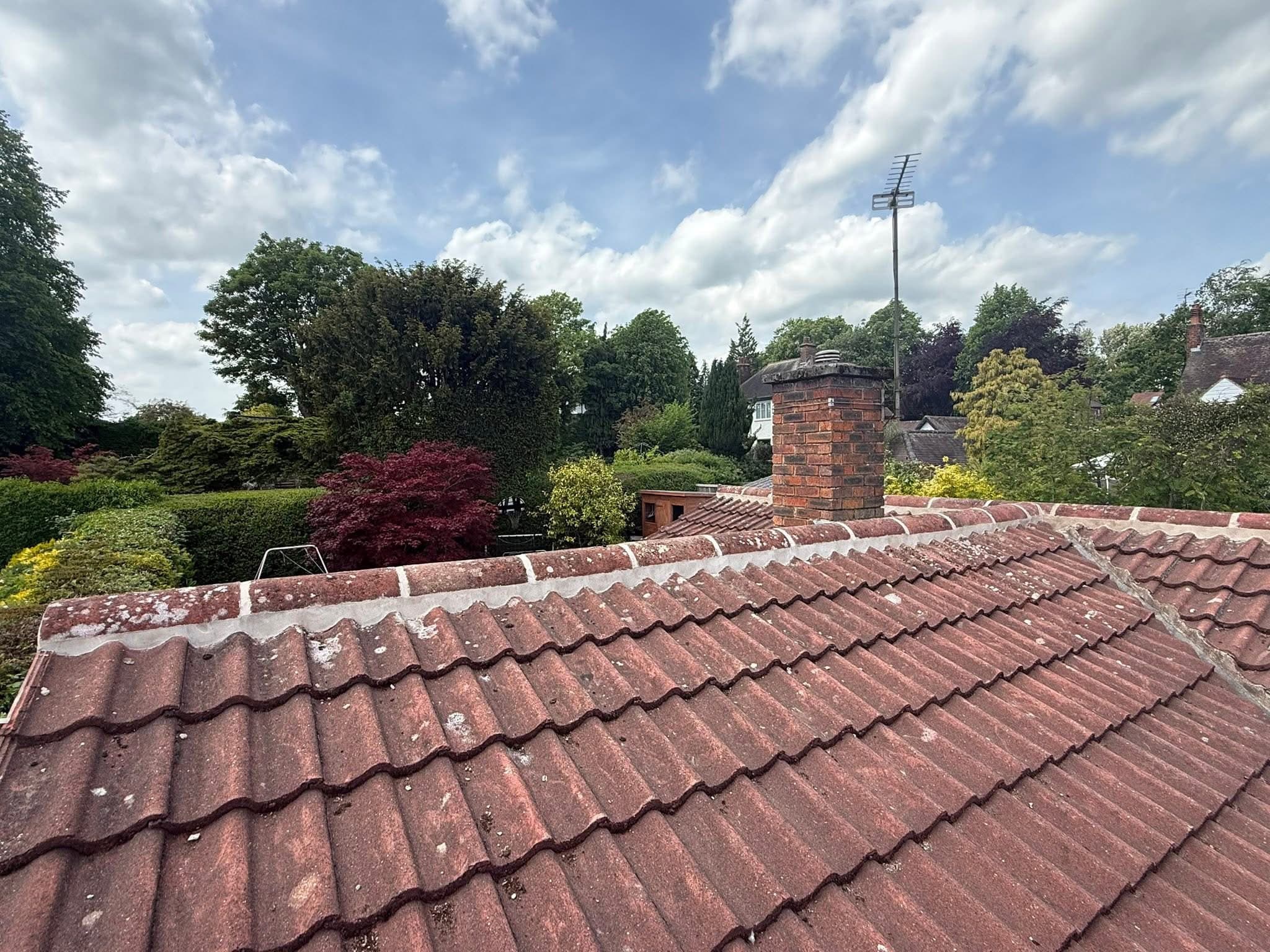 Ridge tiles removed and re-bedded