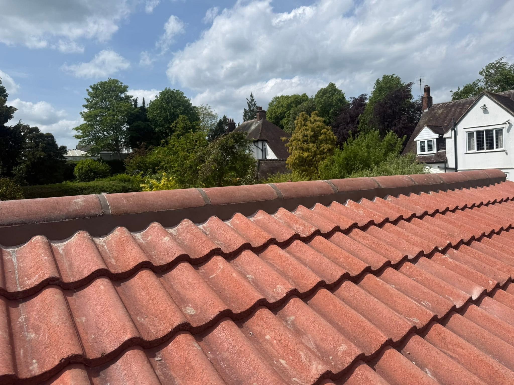 Ridge tiles removed and re-bedded
