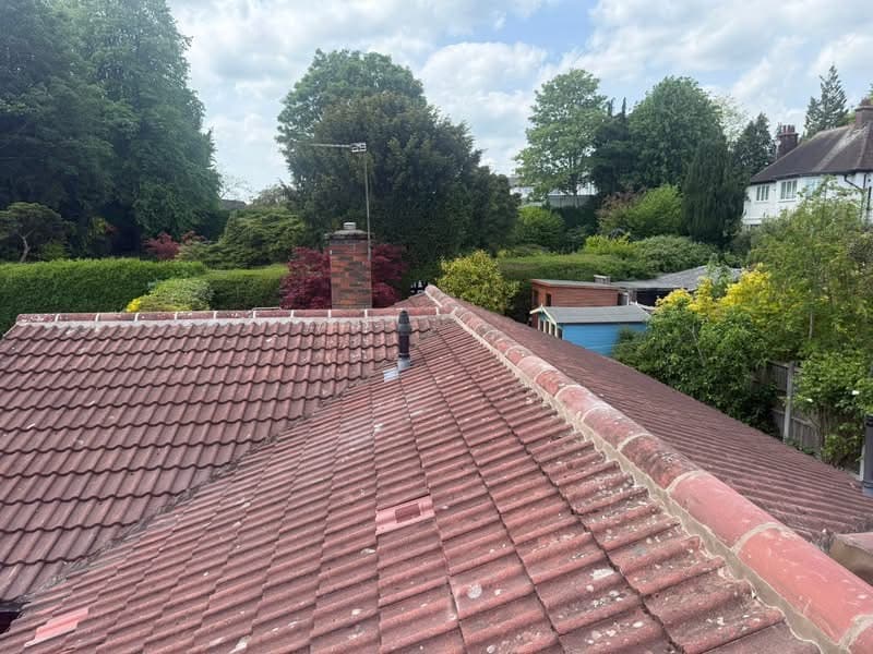 Ridge tiles removed and re-bedded