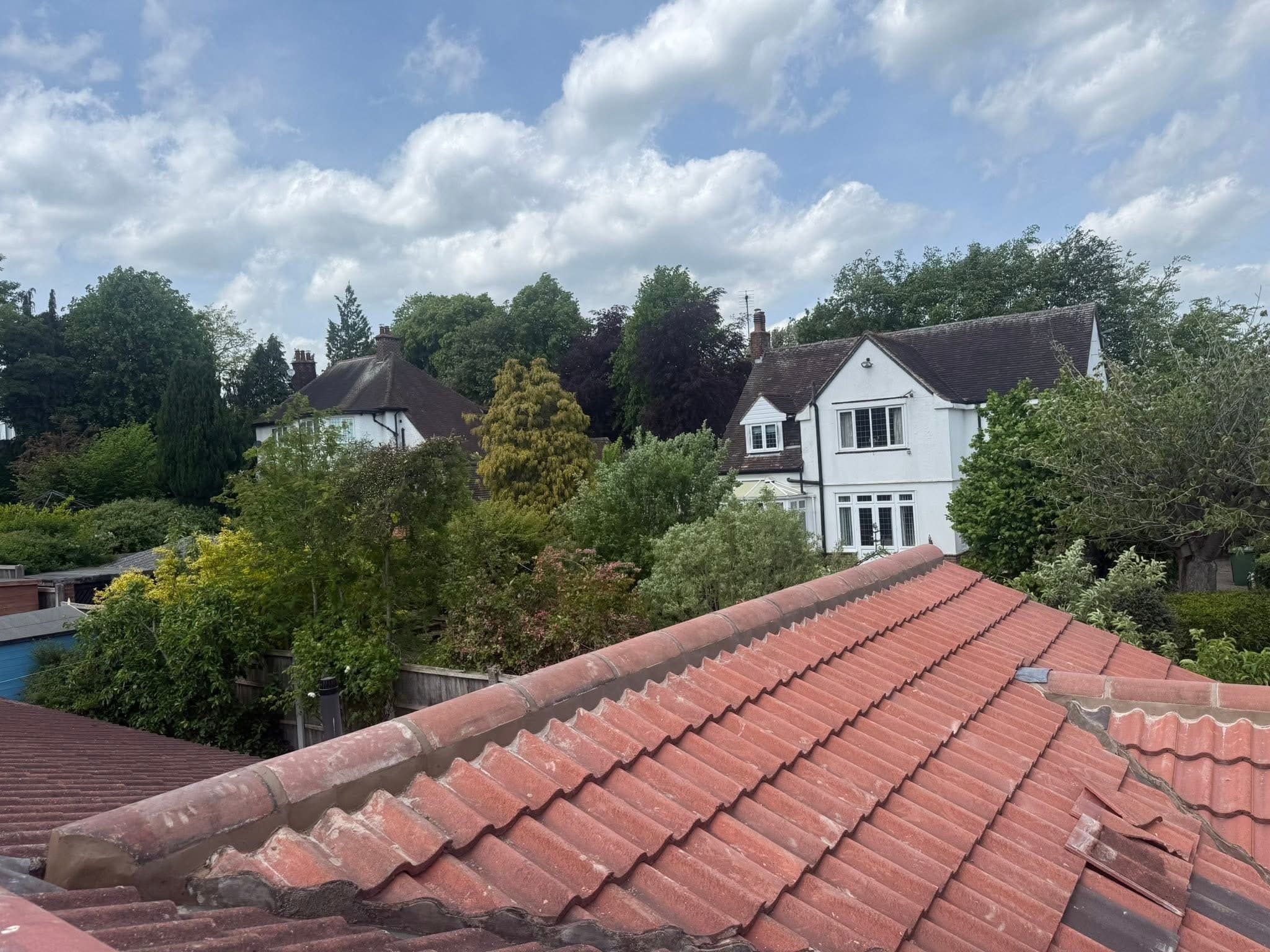 Ridge tiles removed and re-bedded, before