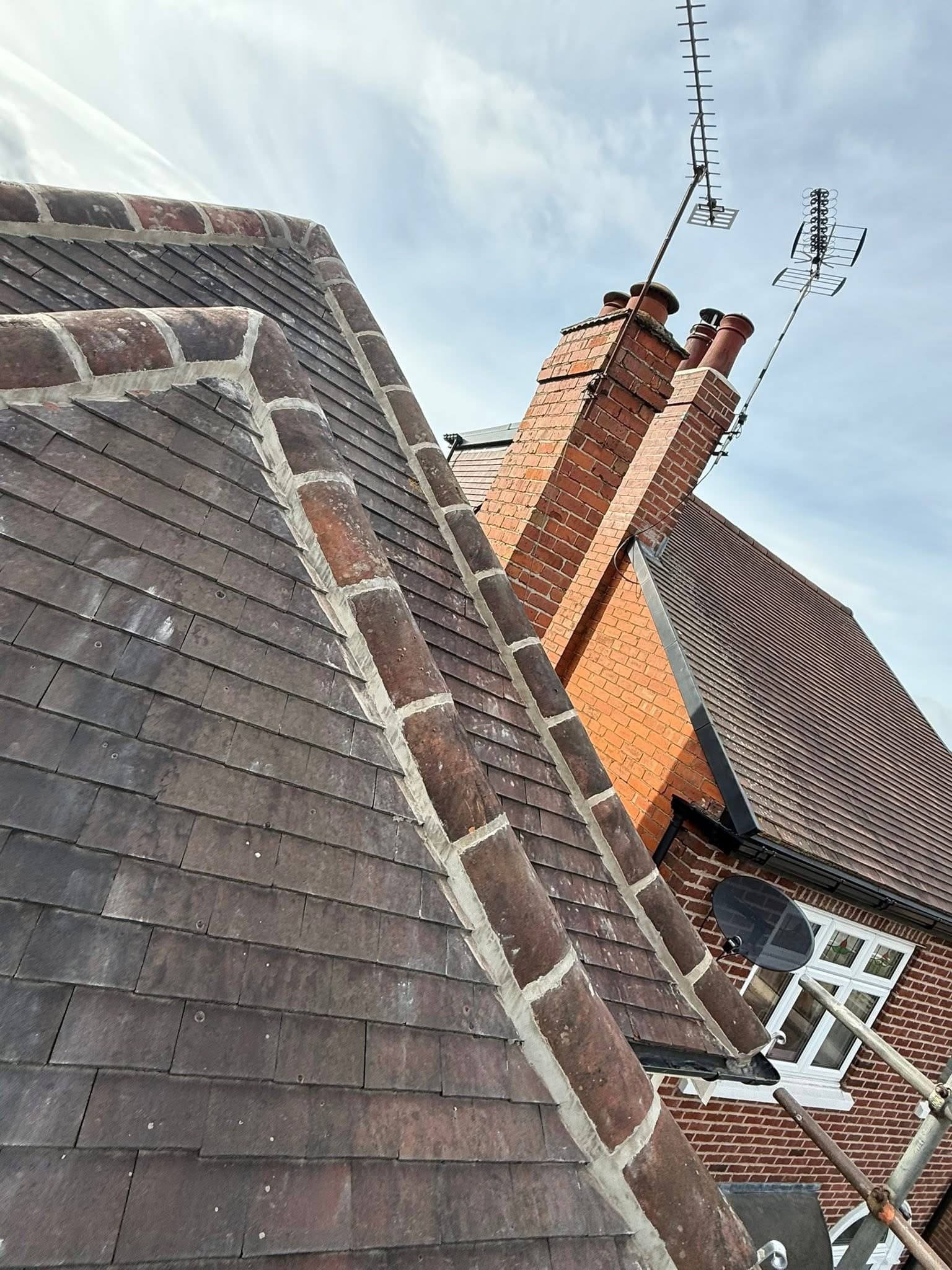 Ridge tiles stripped and re-bedded