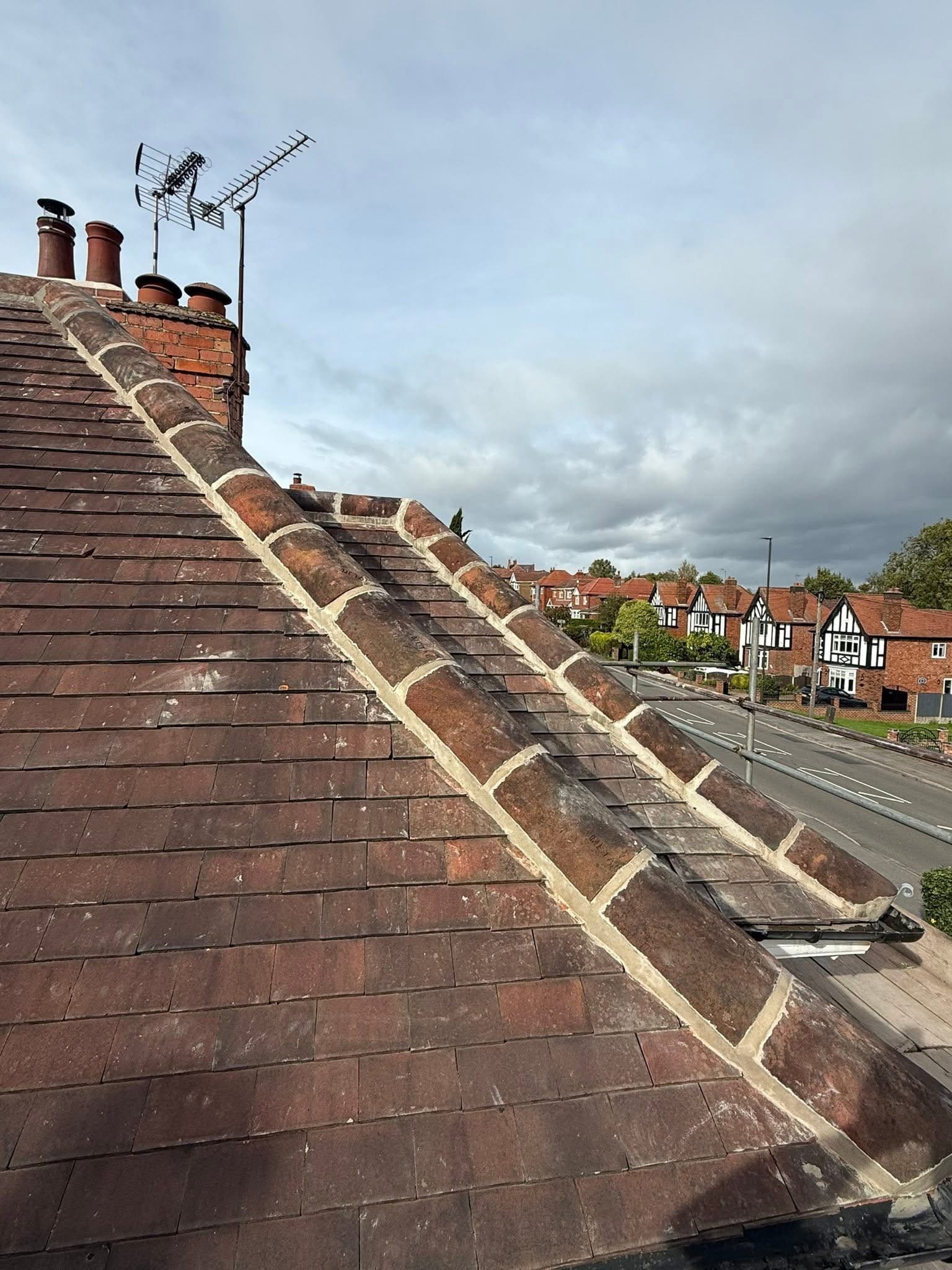 Ridge tiles stripped and re-bedded