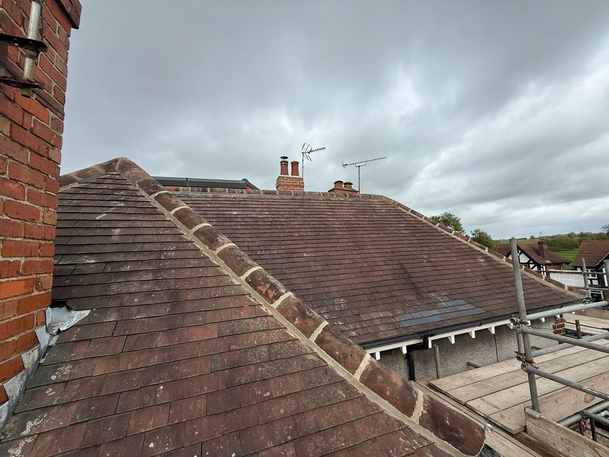 Ridge tiles stripped and re-bedded