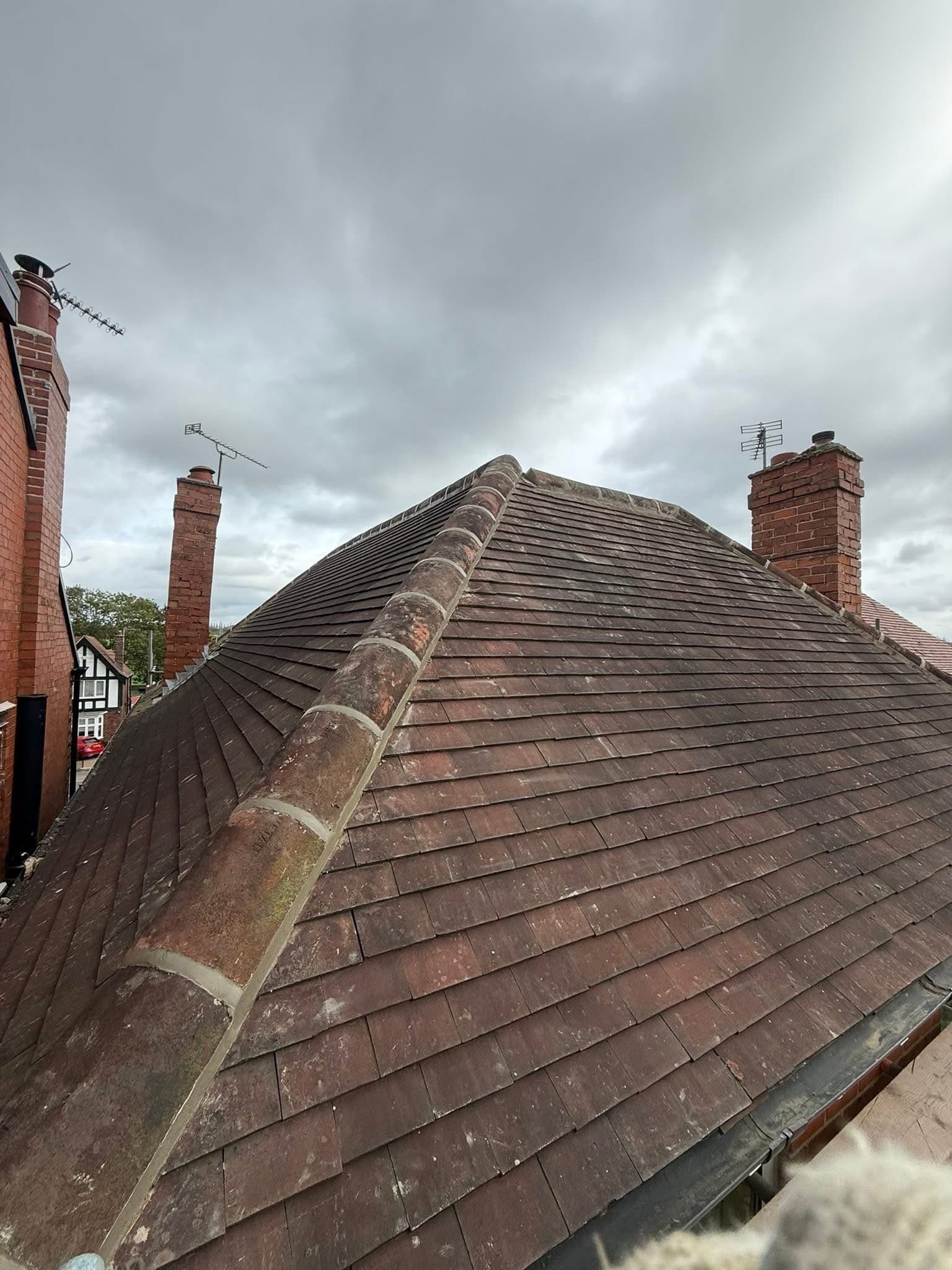 Ridge tiles stripped and re-bedded