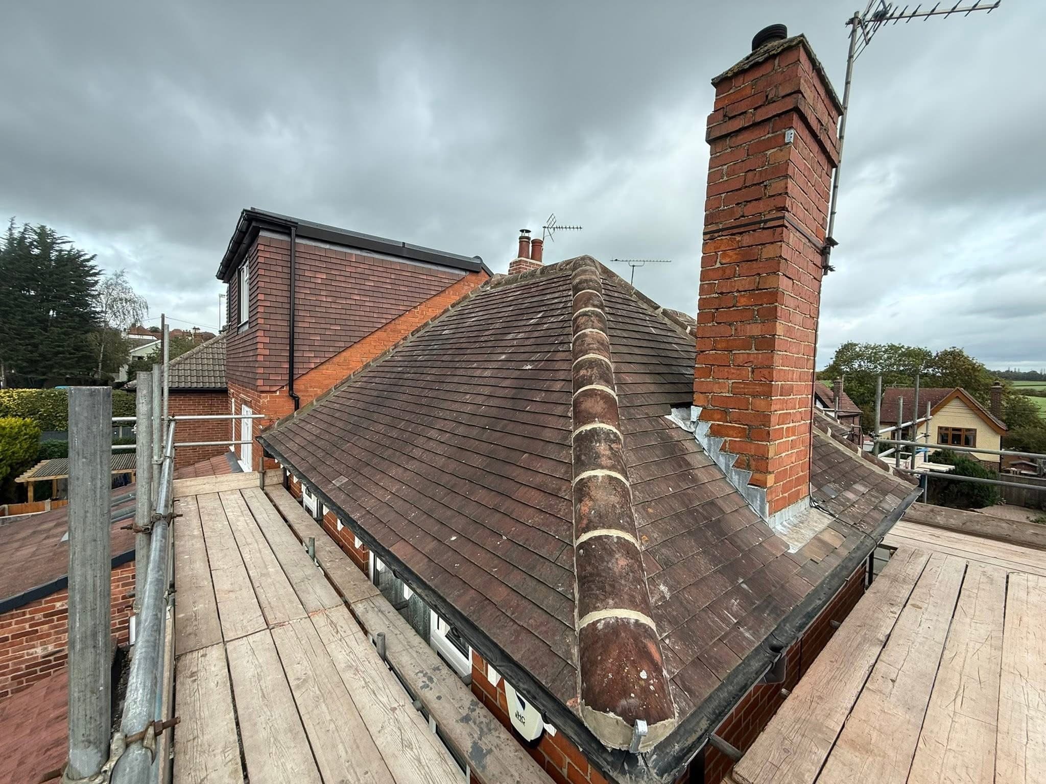 Ridge tiles stripped and re-bedded