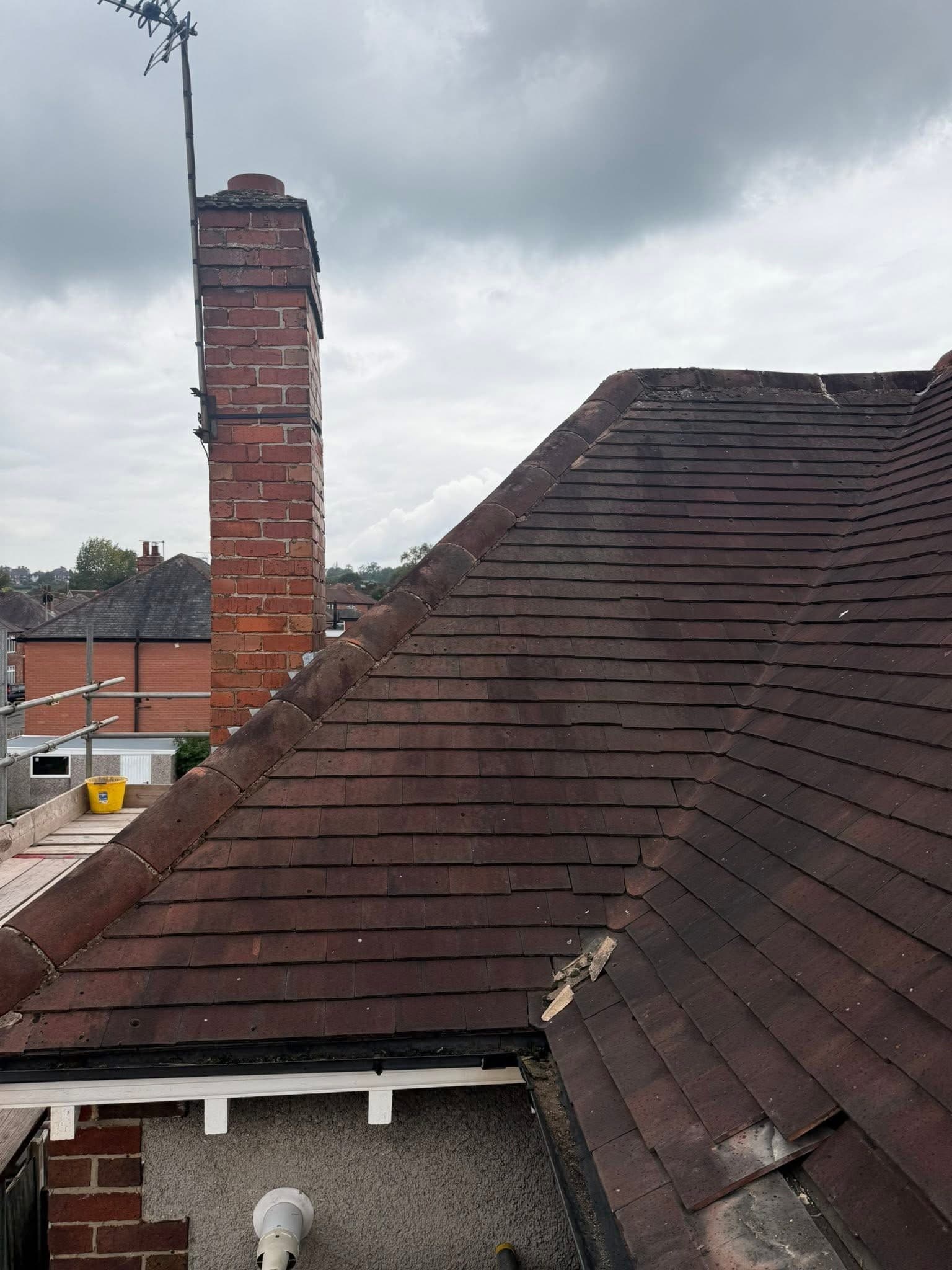 Ridge tiles stripped and re-bedded