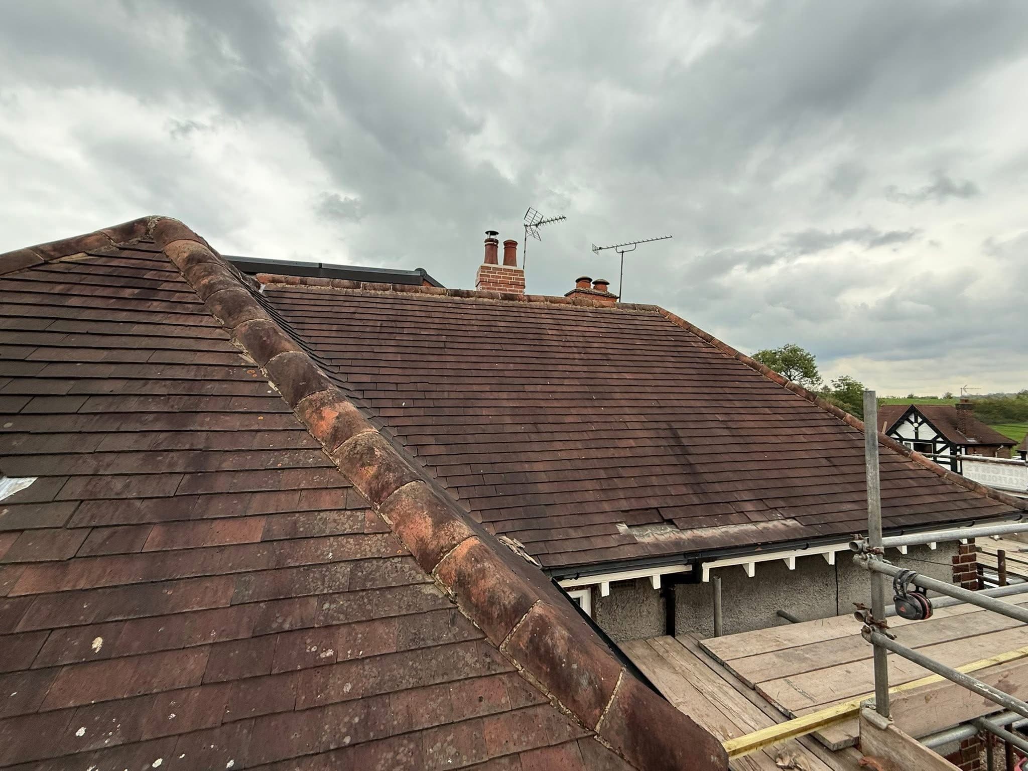 Ridge tiles stripped and re-bedded