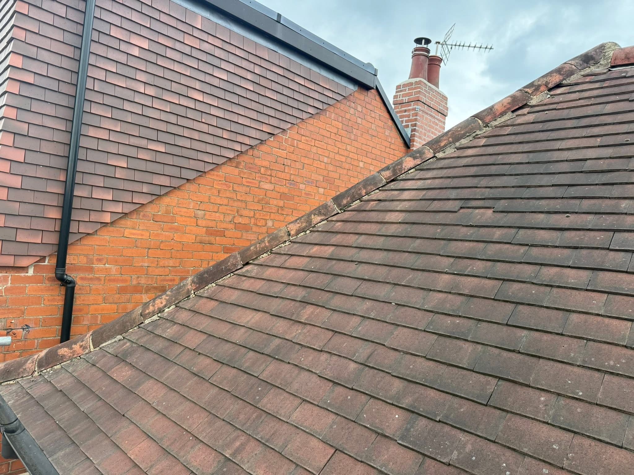 Ridge tiles stripped and re-bedded