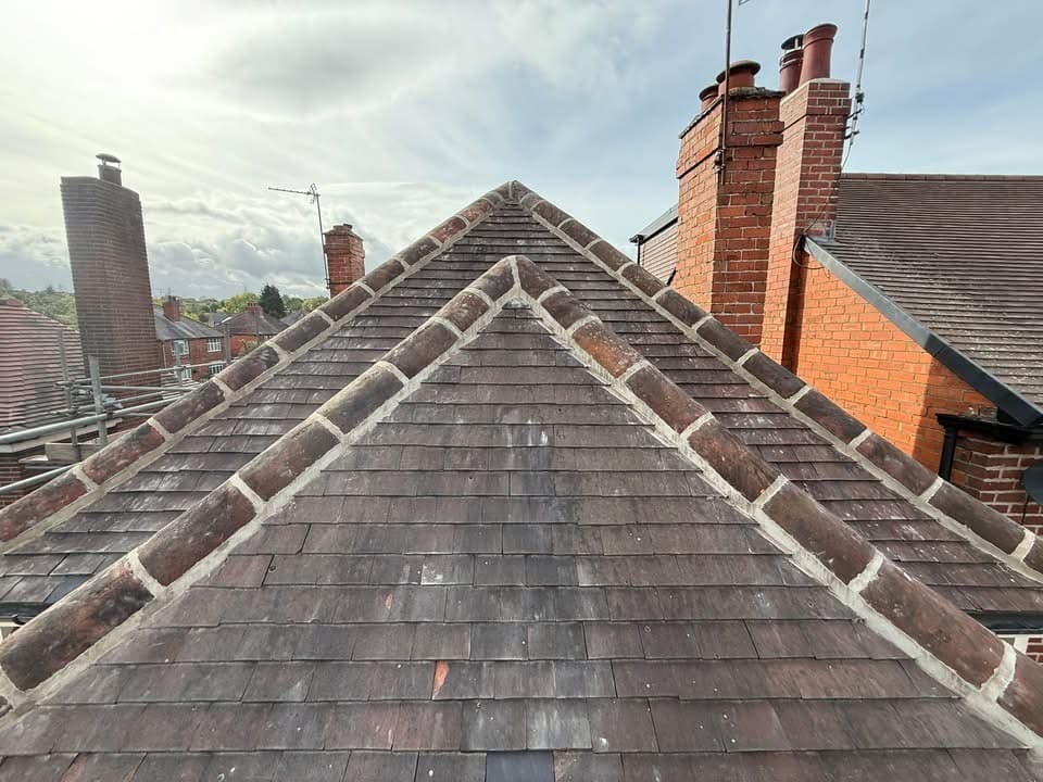Ridge tiles stripped and re-bedded